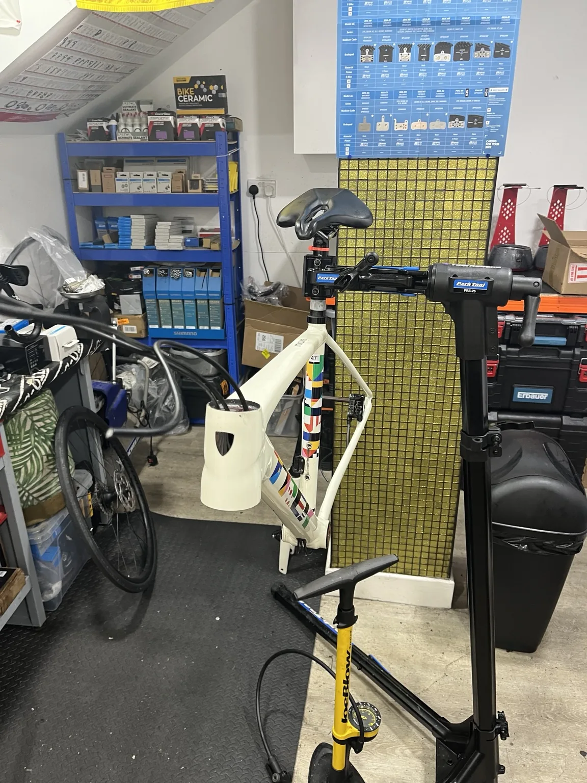 Bike on a repair stand in the TJ CycleWorx workshop